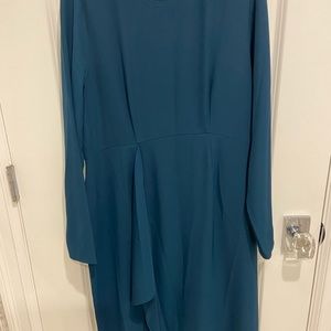 This is a blue long sleeved, maternity dress